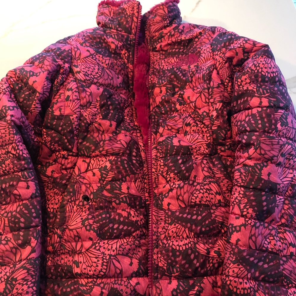 Girls north face reversible jacket— good condition. One burn hole in pocket